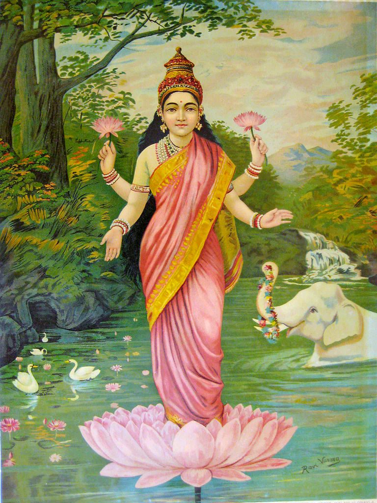 The Hindu goddess Lakshmi of prosperity with pink lotuses in two of her four hands, in standing on a lotus in a river.