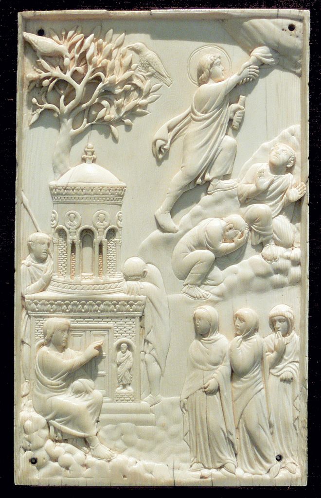 A carved ivory plaque of Jesus being helped to heaven with the disciplines and the women at the grave. a plaque illustrating Jesus's Ascension to Heaven with other figures (the disciplines, the women at the grave)